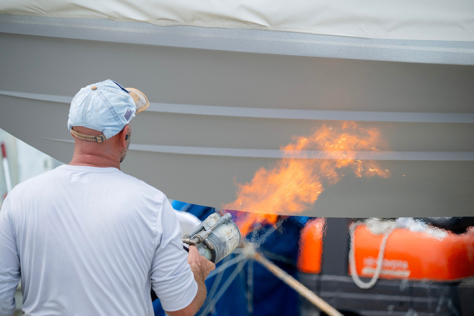Technician performing surface activation for coating